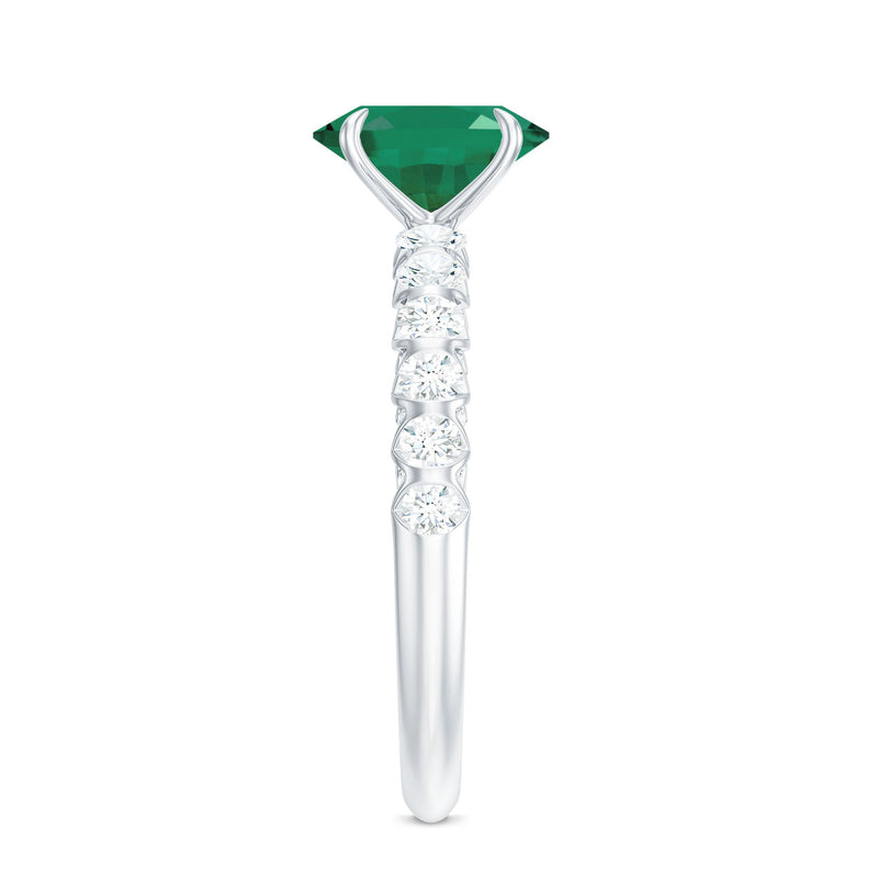 Oval Emerald & Diamond Side Stone Ring