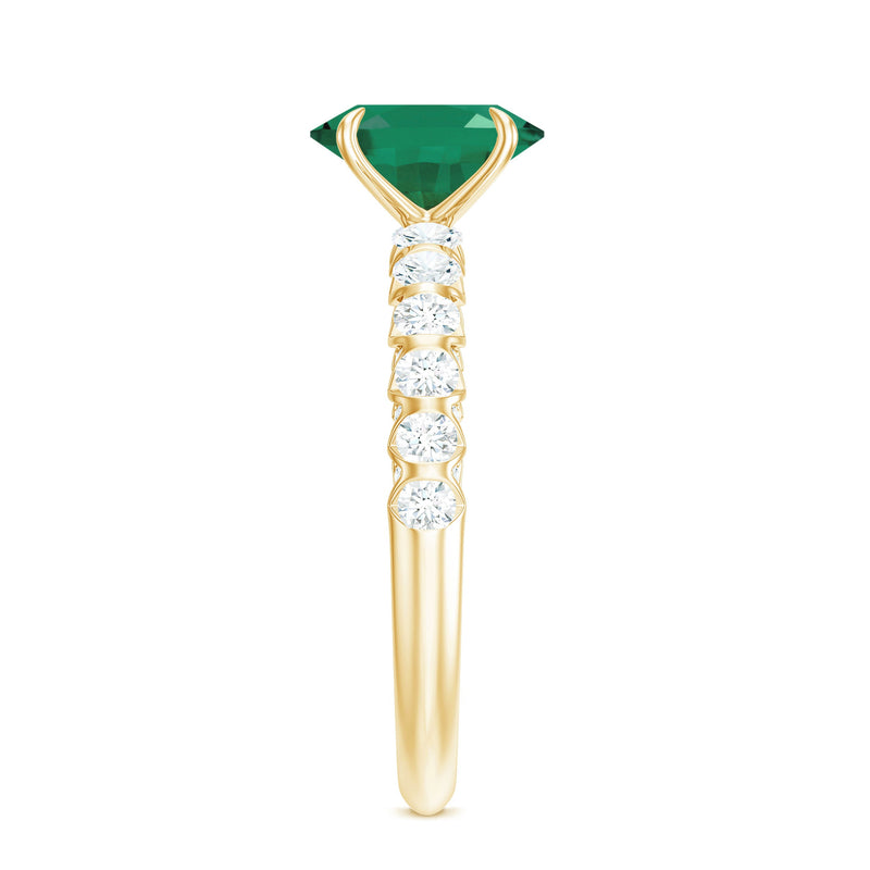 Oval Emerald & Diamond Side Stone Ring
