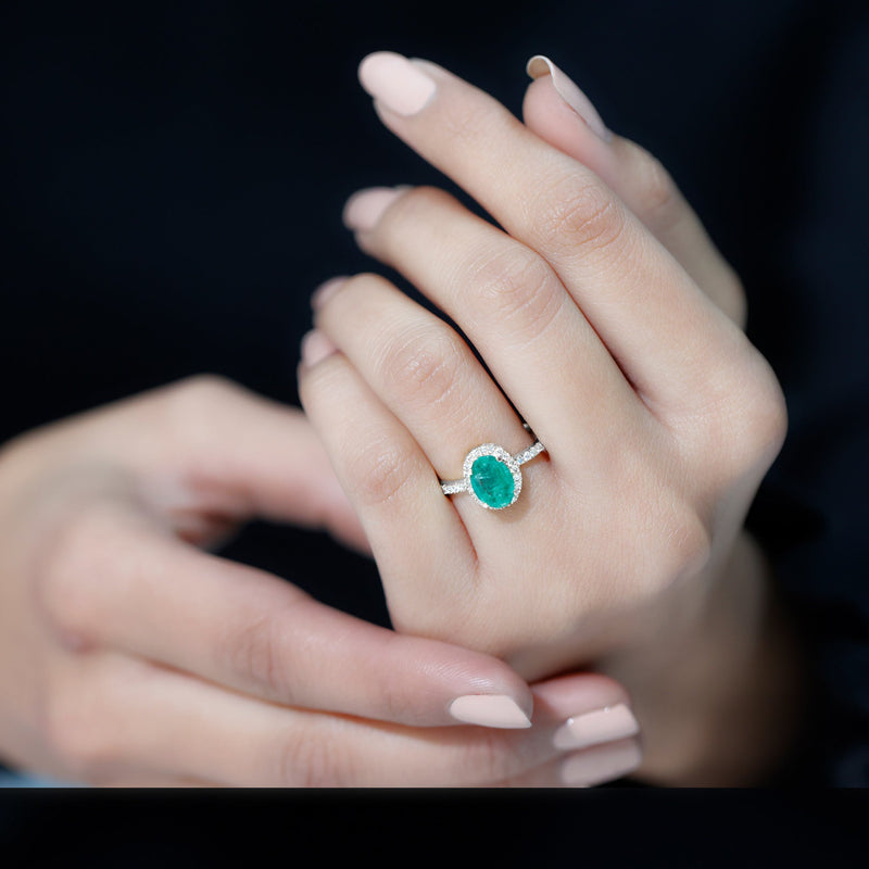 Oval Emerald & Diamond Halo Ring