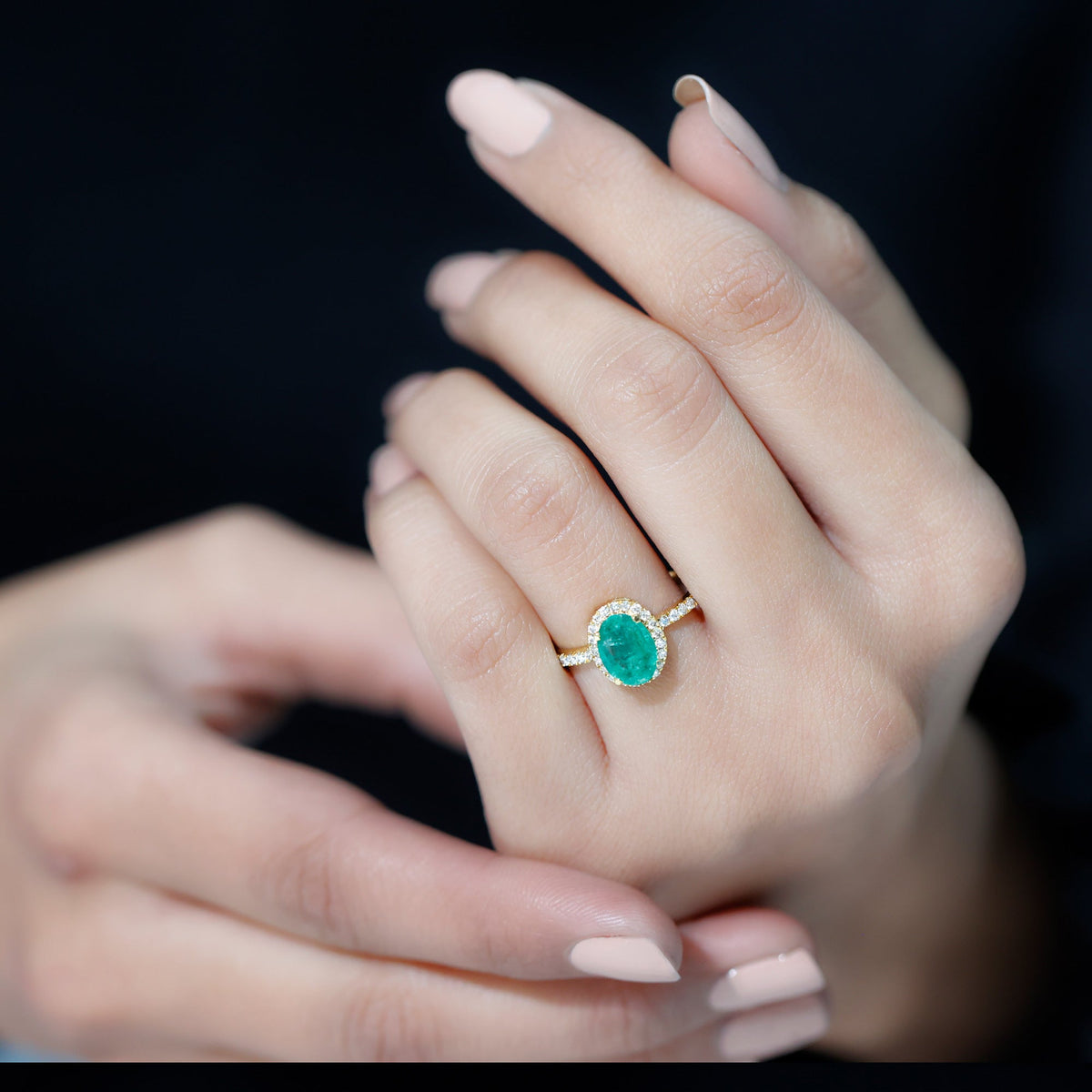 Oval Emerald & Diamond Halo Ring